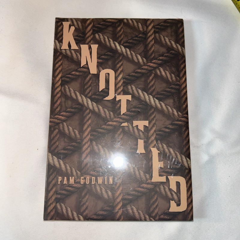 special edition hardcover of «Knotted» by Pam Godwin rope-patterned cover design